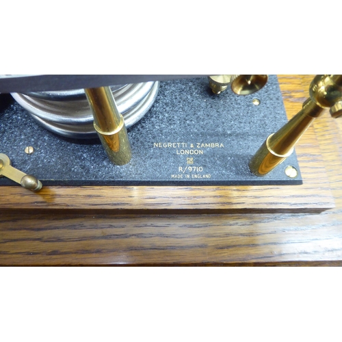 96 - A Negretti and Zambra glazed, oak cased barograph  No.9710  6.5