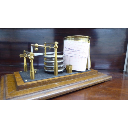 96 - A Negretti and Zambra glazed, oak cased barograph  No.9710  6.5