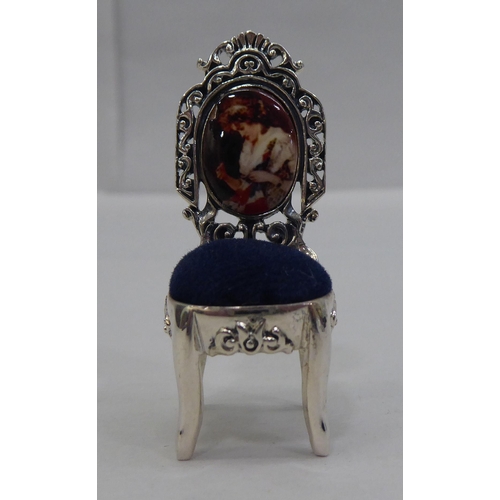 42 - A miniature silver novelty pin cushion, fashioned as an antique chair&nbsp; stamped Sterling