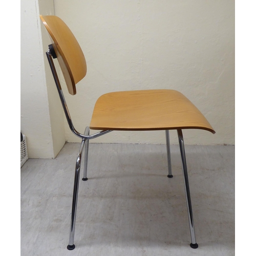 47 - A set of four Charles Eames Original Plywood Group for Vitra chairs, each with a moulded back panel ... 