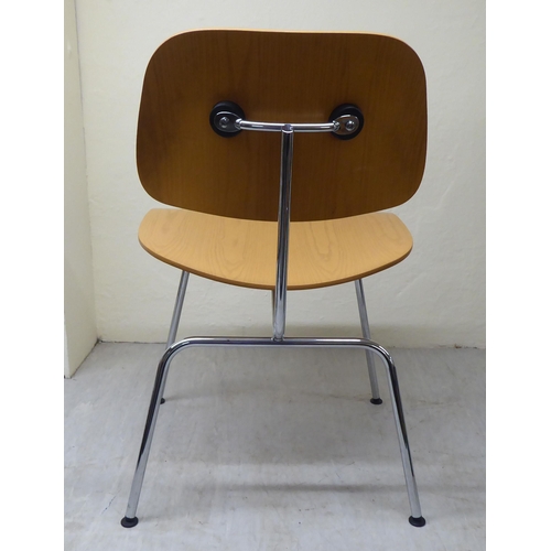 47 - A set of four Charles Eames Original Plywood Group for Vitra chairs, each with a moulded back panel ... 