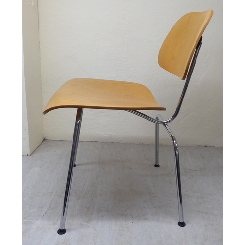 47 - A set of four Charles Eames Original Plywood Group for Vitra chairs, each with a moulded back panel ... 