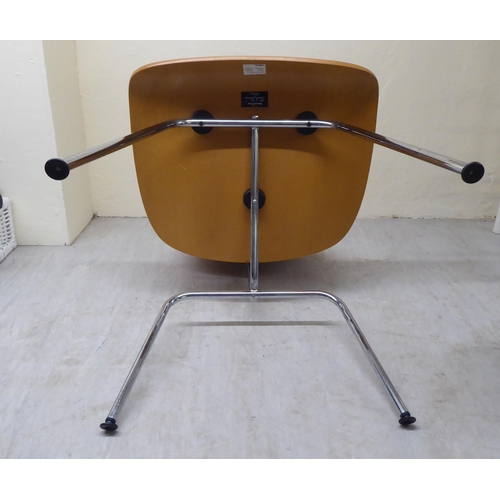 47 - A set of four Charles Eames Original Plywood Group for Vitra chairs, each with a moulded back panel ... 