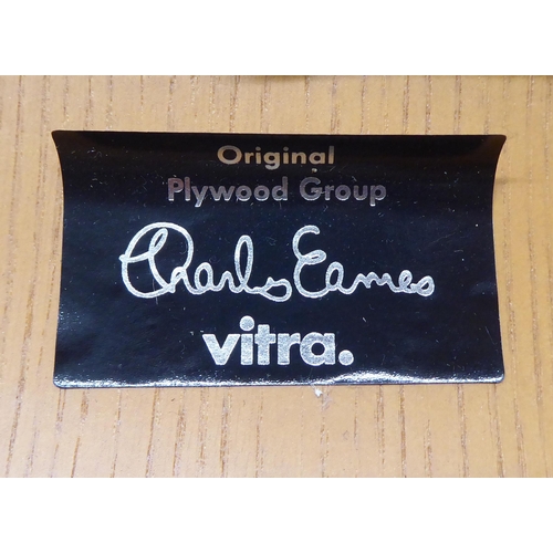 47 - A set of four Charles Eames Original Plywood Group for Vitra chairs, each with a moulded back panel ... 