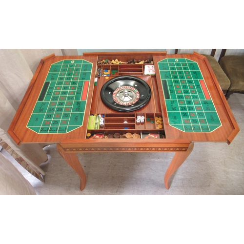 56 - A modern laminated teak effect combination games table, raised on square, tapered, cabriole legs&nbs... 