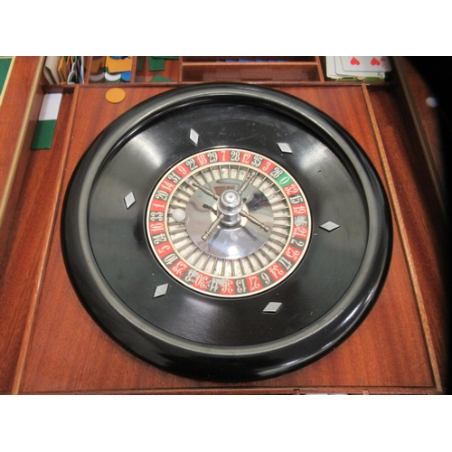 56 - A modern laminated teak effect combination games table, raised on square, tapered, cabriole legs&nbs... 