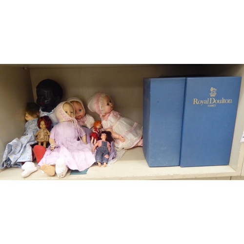 32 - Early 20thC and later china, plastic and other dolls: to include four examples by Royal Doulton from... 