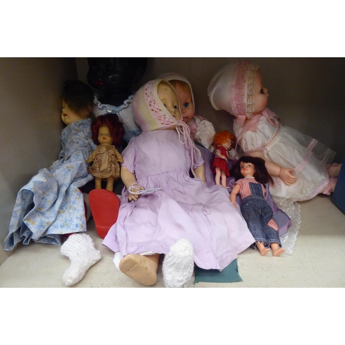 32 - Early 20thC and later china, plastic and other dolls: to include four examples by Royal Doulton from... 