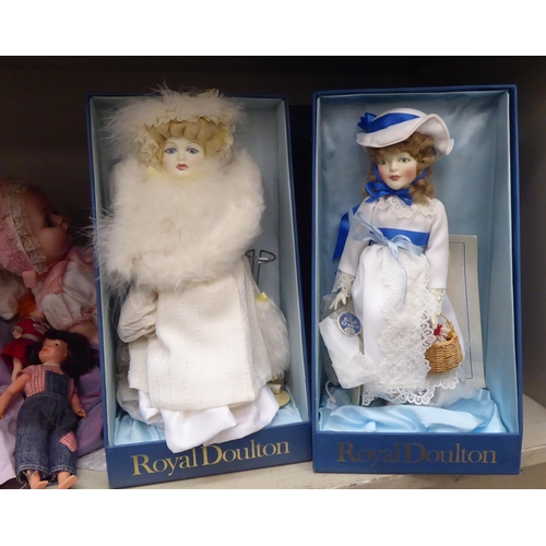 32 - Early 20thC and later china, plastic and other dolls: to include four examples by Royal Doulton from... 