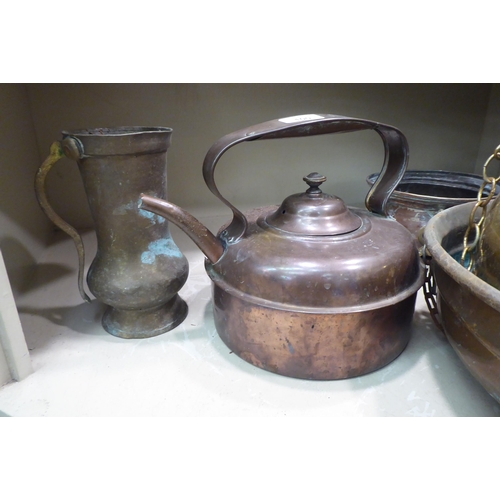 100 - Domestic metalware: to include a copper range kettle; North African brass drinking vessels and a cas... 