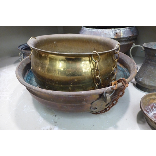 100 - Domestic metalware: to include a copper range kettle; North African brass drinking vessels and a cas... 