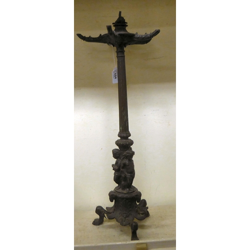 104 - A 19thC cast bronze table lamp, featuring five branches, over a central column, supported by three c... 