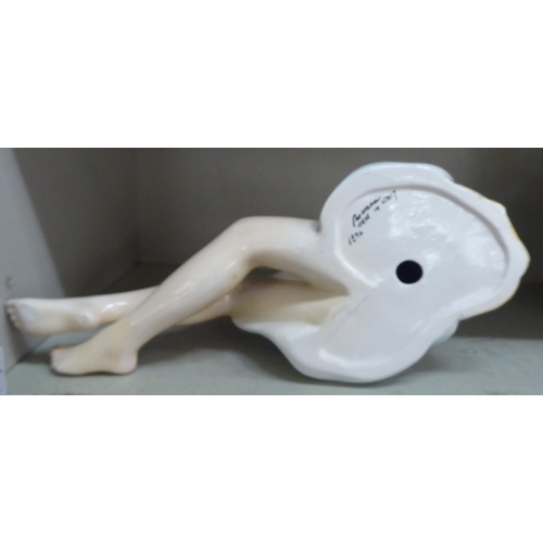 112 - A modern Italian pottery figure, a reclining woman  13