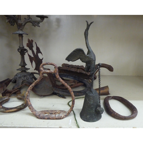 122 - A late 19thC cast iron cork press; and an iron triple branch candlestick  14