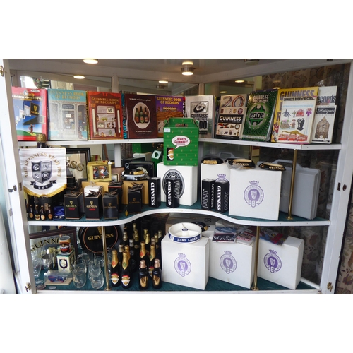 123 - An extensive collection of Guinness memorabilia: to include unopened bottles, commemorating various ... 