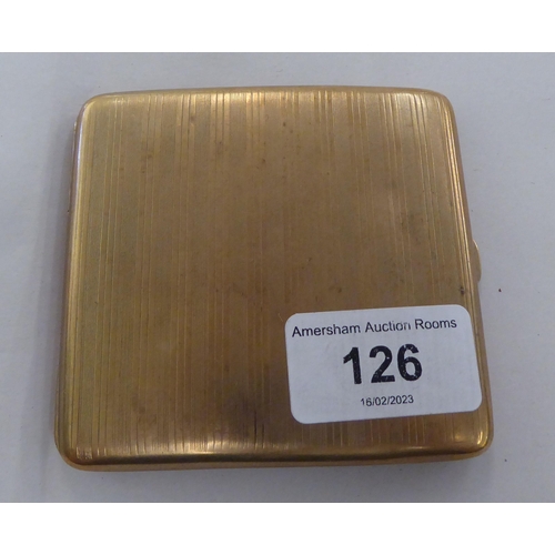 126 - An Asprey & Co 9ct gold, folding, engine turned cigarette case, on a button clasp