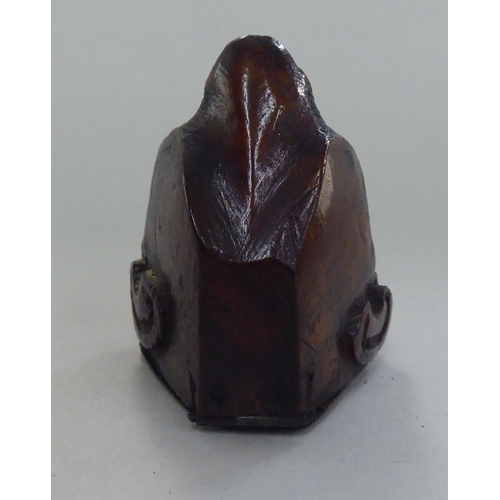 135 - An 18thC walnut novelty snuff box, naively carved as a monkeys head with a hinged lid