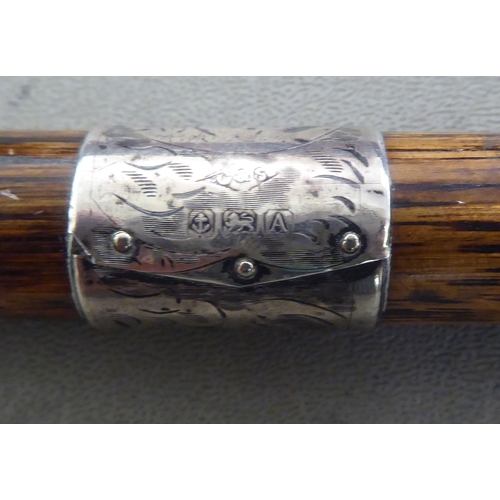 138 - A late Victorian ladies walking cane with a crook handle, engraved silver ferrule and cap terminal&n... 