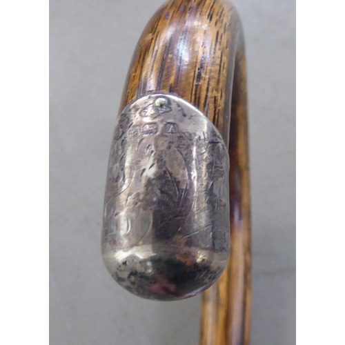 138 - A late Victorian ladies walking cane with a crook handle, engraved silver ferrule and cap terminal&n... 