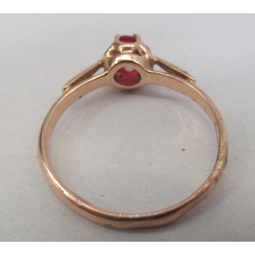 148 - A 14ct gold ring, set with a single red stone