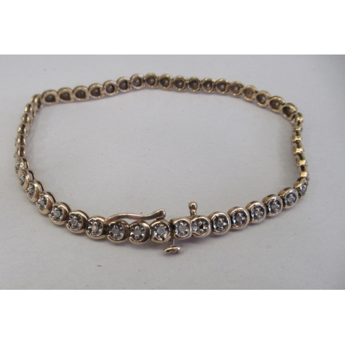 149 - A 9ct gold diamond set bracelet