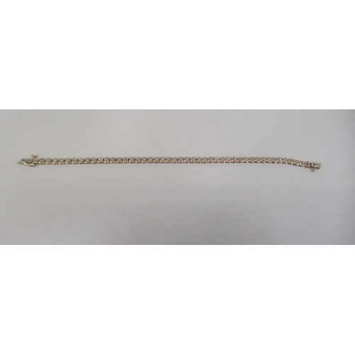 149 - A 9ct gold diamond set bracelet