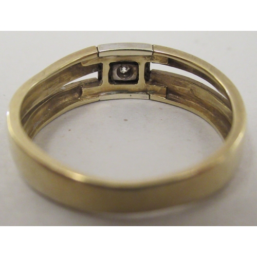 150 - A 9ct bi-coloured gold ring, set with a central diamond