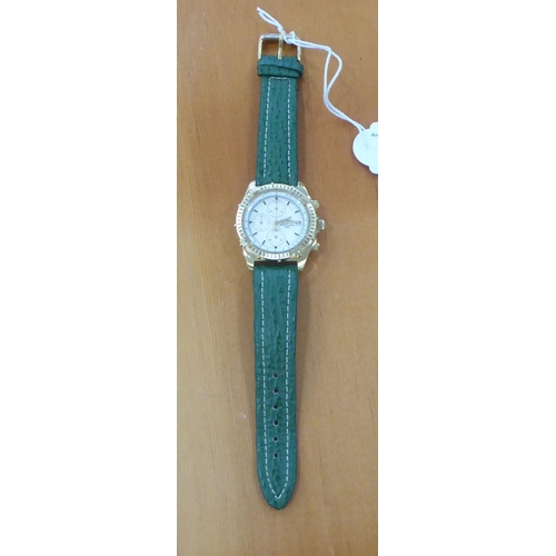 155 - A gold plated wristwatch, on a green hide strap