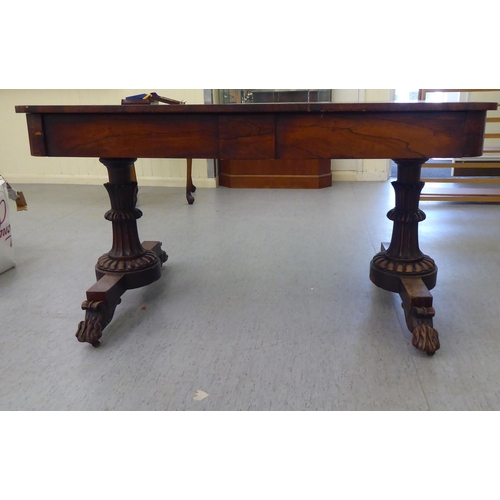 16 - A William IV rosewood centre table with two frieze drawers, raised on opposing fluted pillar support... 