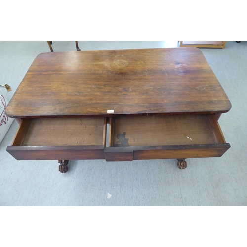 16 - A William IV rosewood centre table with two frieze drawers, raised on opposing fluted pillar support... 