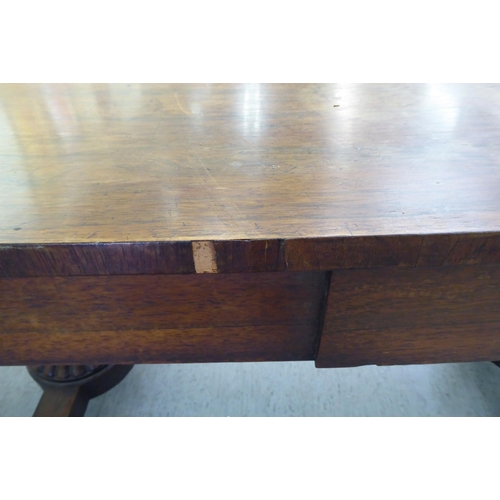 16 - A William IV rosewood centre table with two frieze drawers, raised on opposing fluted pillar support... 