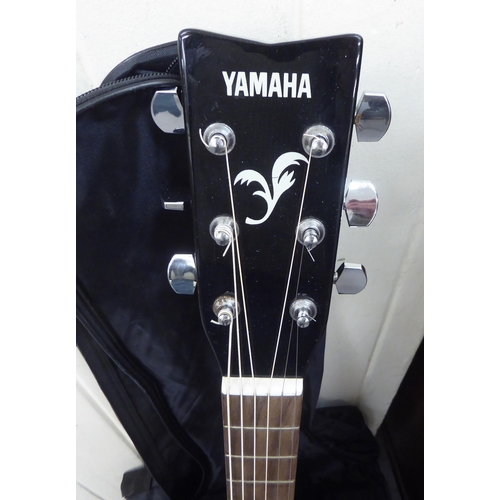 166 - A Yamaha six string F-340 BL accoustic guitar, in a sleeve 