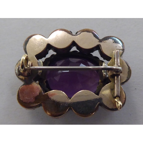 169 - A gold coloured metal cameo stickpin  cased; and a brooch, set with amethyst coloured stones&nb... 