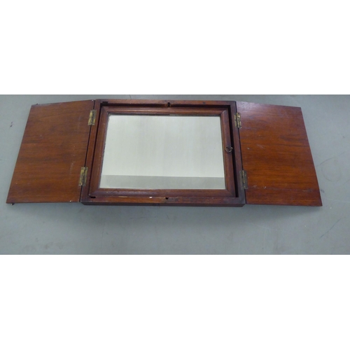 173 - A 20thC Chinese elm box design mirror, folding into a base, incorporating a ratchet  16