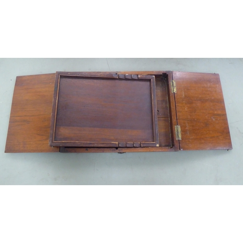 173 - A 20thC Chinese elm box design mirror, folding into a base, incorporating a ratchet  16