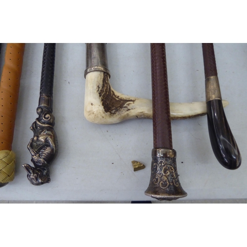 183 - Eight various riding crops: to include three with silver mounts