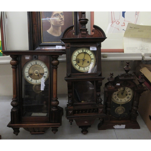 184 - Three late 19thC walnut cased clocks: to include a drop dial example; the 8 day movement faced by a ... 