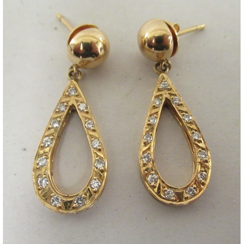 207 - A pair of 18ct gold teardrop shaped earrings, set with diamonds