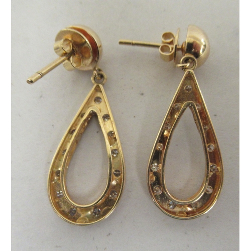 207 - A pair of 18ct gold teardrop shaped earrings, set with diamonds