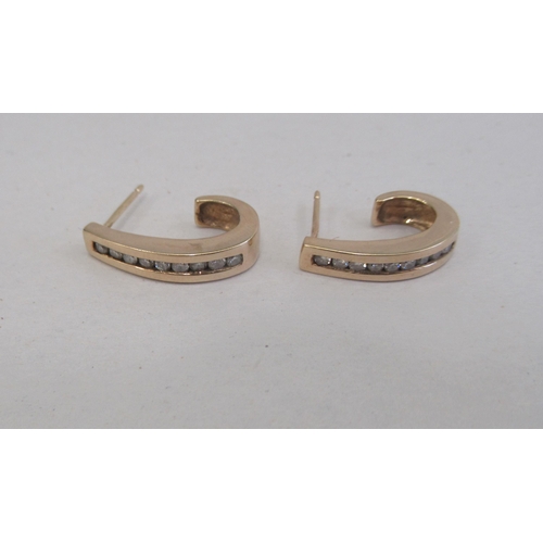 209 - A pair of 9ct gold diamond set earrings