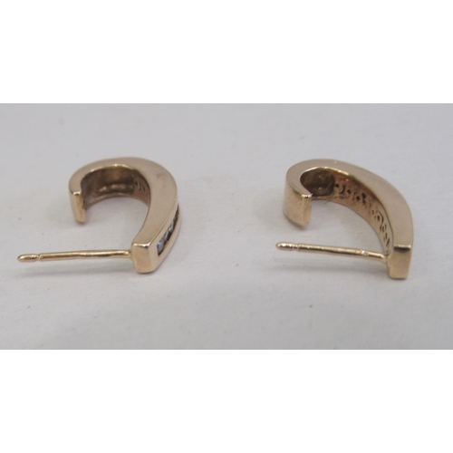 209 - A pair of 9ct gold diamond set earrings