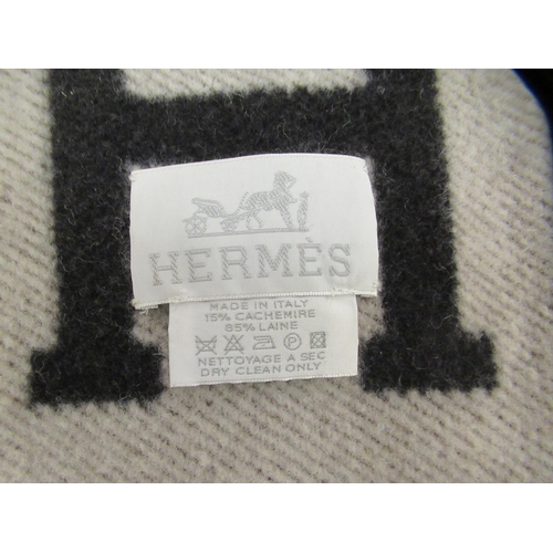 225 - Three Hermes style Cashmere and wool throws  various sizes and a matching cushion