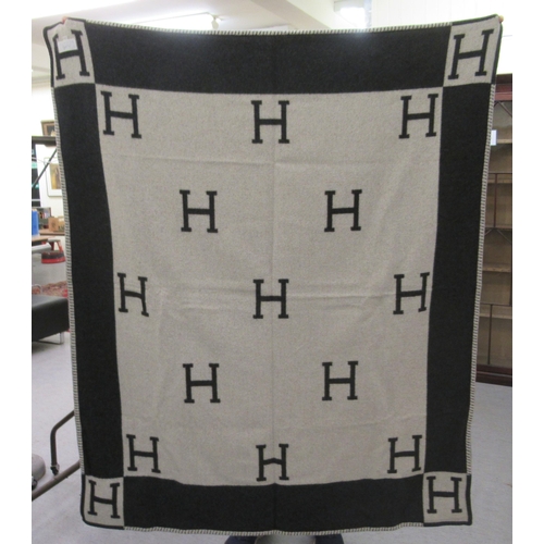 225 - Three Hermes style Cashmere and wool throws  various sizes and a matching cushion