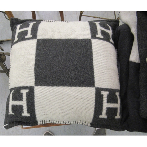 225 - Three Hermes style Cashmere and wool throws  various sizes and a matching cushion