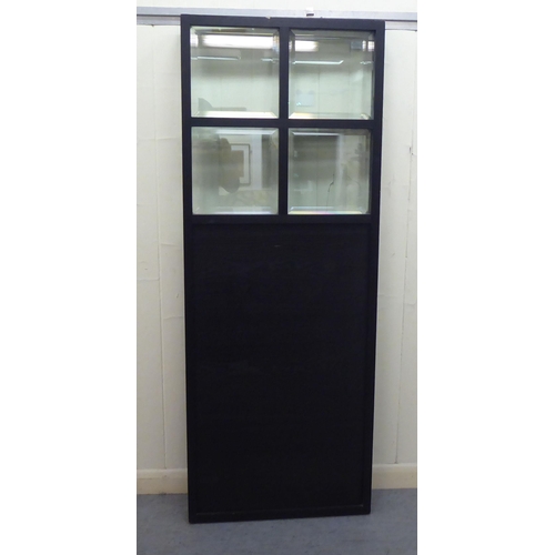 23 - A modern black ash framed three fold, glazed and panelled dressing room screen  each panel 64