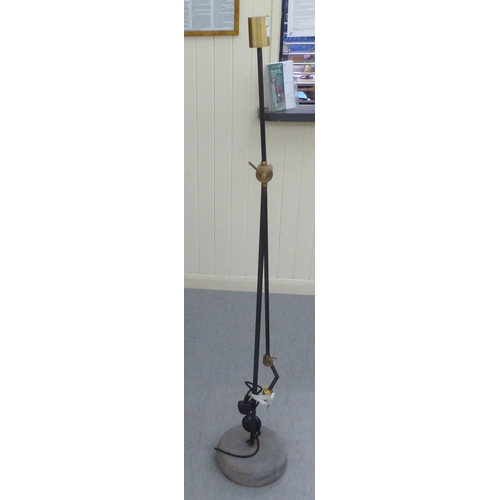 233 - A modern Loaf standard lamp with a counterbalanced bi-coloured steel stem, on a height adjustable an... 