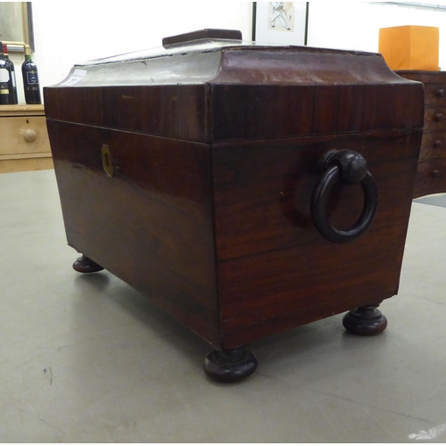 237 - A 19thC rosewood tea casket of sarcophagus form with opposing ring handles, the hinged lid enclosing... 