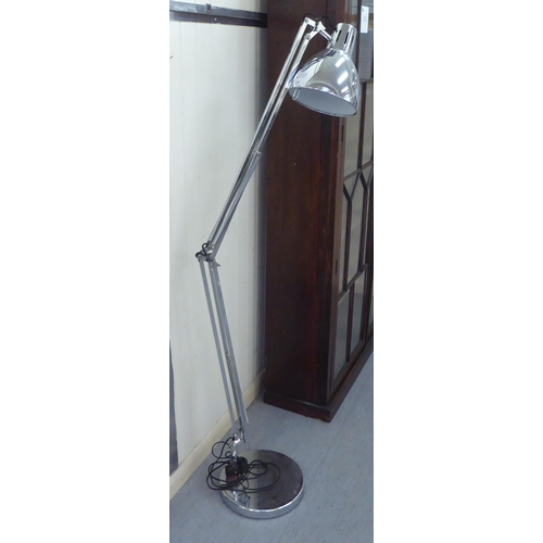 238 - A modern chromium plated steel standard lamp, in the style of an anglepoise 