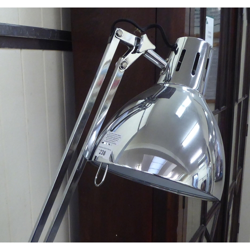 238 - A modern chromium plated steel standard lamp, in the style of an anglepoise 