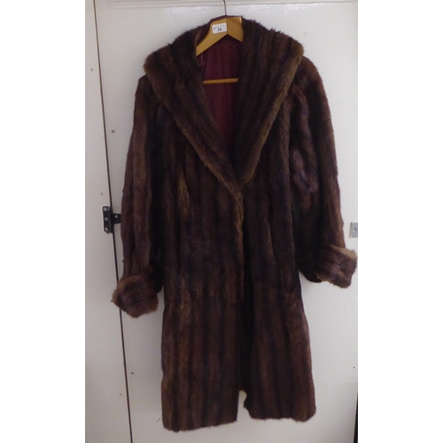 24 - A vintage two tone, three-quarter length fur jacket